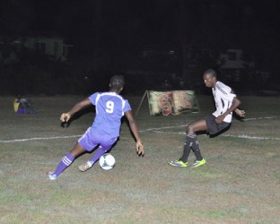 Troulin Daniels (no.9) of Ann’s Grove trying to evade is marker Devon Jeffers of Agricola Red Triangle during their matchup