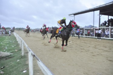  Curfew Tower galloping to victory in the feature D and Lower event of yesterday’s Guyana Cup Rematch. (Orlando Charles photo)