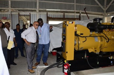President Donald Ramotar being given a tour of the generating sets at the commissioning of the 24-hour service at the Leguan Power Station. (GINA photo)