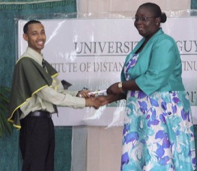 2014 top student Keshri Jailall receiving his certificate 