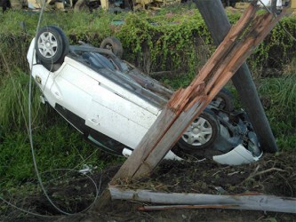 The car after it collided with the utility pole 