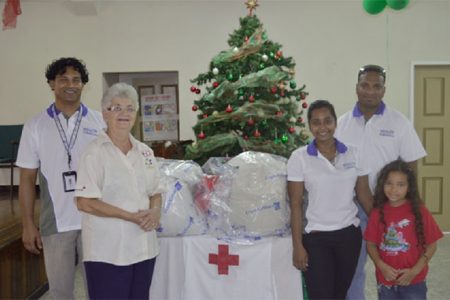 This Copa photo shows staff of the airline with Dorothy Fraser (second from left) of the Red Cross.