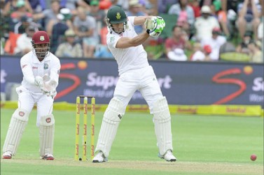Faf du Plessis hits down the ground during day 1 of the 2nd Test match between South Africa and West Indies at St. Georges Park on December 26, 2014 in Port Elizabeth, South Africa. (Photo by Duif du Toit/Gallo Images)