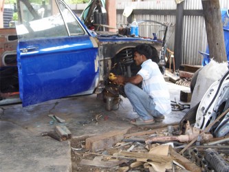 Fixing a car at the mechanical workshop 