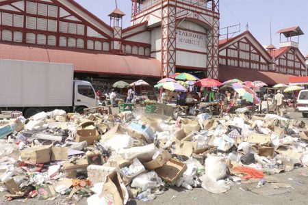 Trashed: Garbage strewn outside Stabroek Market yesterday. (Photo by Arian Browne)