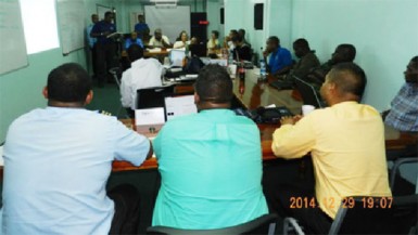 Personnel being briefed at the Rescue Coordination Centre last evening. (Photo courtesy of the Guyana Civil Aviation Authority)