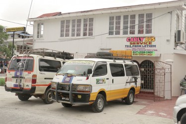 The new premises of Carly and Cindy Bus Service with two of the buses parked outside. (Photo by Arian Browne)