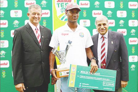 Kraigg Brathwaite collects his Man of the Match award and cheque at the end of the second Test match against South Africa at St George’s Park in Port Elizabeth yesterday. WICB Media Photo
