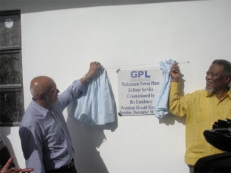 President Donald Ramotar (left) and Prime Minister Samuel Hinds unveil the plaque.  