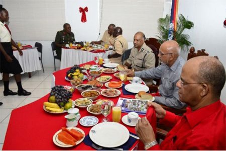 President Donald Ramotar (second from right) joined Minister of Home Affairs, Clement Rohee (right) and heads and senior ranks of the Joint Services at the annual Police Officers’ Christmas breakfast, hosted by Police Commissioner (ag) Seelall Persaud (third from right) at the Commissioner’s Office, Eve Leary, today. (GINA photo)