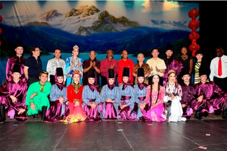 President Donald Ramotar, Prime Minister Samuel Hinds, and Home Affairs Minister Clement Rohee with Chinese Ambassador Zhang Limin  take a photo opportunity with Chinese Acrobats at the National Cultural Centre. The event was sponsored by the Ministry of Culture, Youth and Sport and the Chinese Association yesterday. (GINA photo)