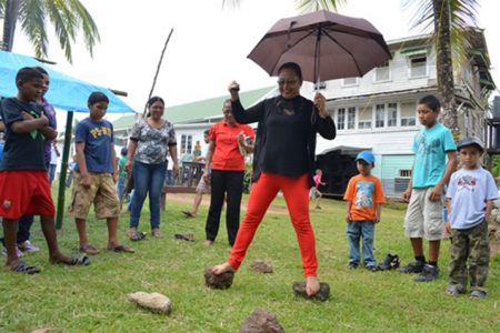 Minister of Amerindian Affairs Pauline Sukhai displays her agility in one of the novelty games at the fun-day on Saturday. (GINA photo)