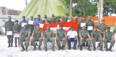 Seventeen new special forces and paratroopers posing with GDF top brass yesterday at Base Camp Stephenson. (GDF photo)