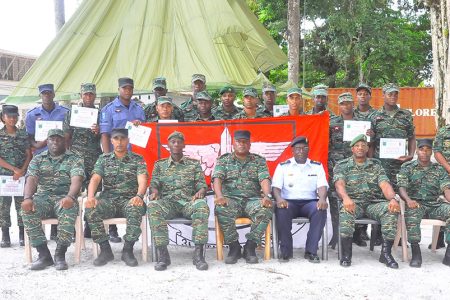 Seventeen new special forces and paratroopers posing with GDF top brass yesterday at Base Camp Stephenson. (GDF photo)
