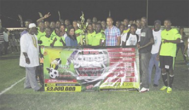 Grove Hi-Tech captain Sherman Doris collecting the championship trophy from Ansa McAl PRO Darshanie Yussuf while members of the club inclusive of players and executives look on. 