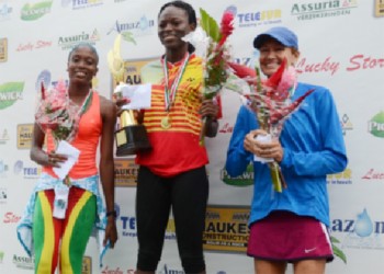 Alika Morgan winner of the female version of the Bigi Broki Waka 10 K race in Suriname is flanked by second place finisher Andrea Foster of Guyana and Carolien Marlet of the Netherlands.