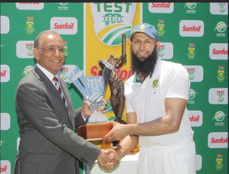 South Africa skipper Hashim Amla receives the trophy for winning the series against the West Indies from Haroon Lorgat at the end of the fifth day of the 3rd Test between South Africa and West Indies at Sahara Park Newlands yesterday in Cape Town, South Africa. (Photo by Carl Fourie/Gallo Images) 