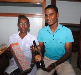  Jo-Ann and Vishal Joseph display a sample of JJV Cellars well turned-out product. 