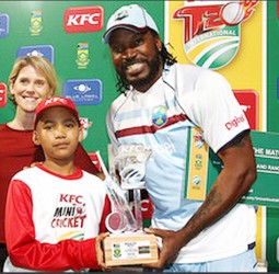 STILL THE MAN! Garth Strauss of the KFC Mini-Cricket hands Chris Gayle of the West Indies the Man of the Match Trophy after the first KFC T20 International match against South Africa at Sahara Park Newlands  yesterday in Cape Town, South Africa. (Photo by Shaun Roy/Gallo Images) 
