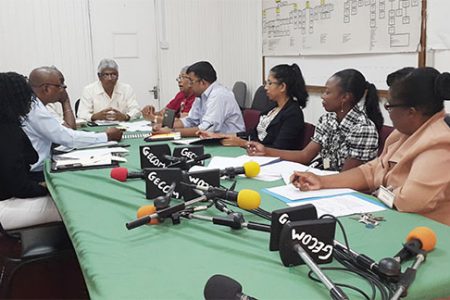 Gecom members (at left) meeting with the delegation from the National Commission on Disability. (Gecom photo)