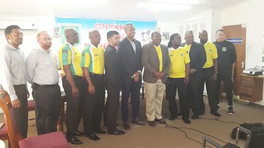 Newly Appointed Head-Coach Jamaal Shabazz (seventh from left) posing for a photo opportunity while being flanked by members of GFF Normalization Committee and technical staff inclusive of Chairman Clinton Urling (sixth from left) and GFF Technical Director Claude Bolton (right)