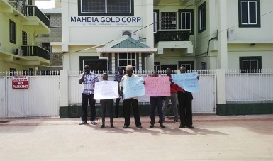 Angry axed workers protesting outside the Mahdia Gold Corp yesterday morning. 