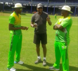 From left: Guyana Jaguars fast bowler Ronsford Beaton takes in a few pointers from ex West Indies pacer Colin Croft (middle) in the presence of head coach Esaun Crandon yesterday at the Queens Park Oval ground, Trinidad & Tobago ahead of today’s first match against the Windward Islands Volcanoes. 
