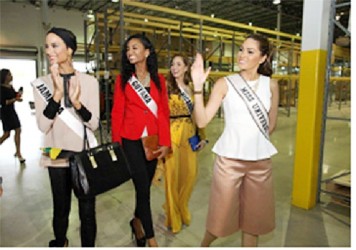 Reigning Miss Universe Gabriela Isler of Venezuela, on far right, tours Food For The Poor’s warehouse with Miss Universe contestants (from left) Miss Jamaica Kaci Fennell, Miss Guyana Niketa Barker and Miss Nicaragua Marline Barberena. 