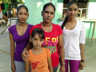 Soorsattie Chandrapaul (centre) and three of her four children 