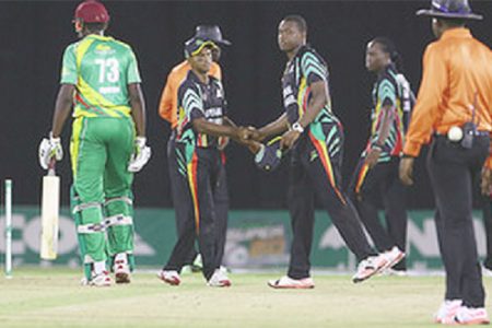 Guyana captain Christopher Barnwell shakes the hand of Shivnarine Chanderpaul after victory was achieved in  the Zone “A” match against the Windward Islands Volcanoes in the NAGICO Super50 Tournament on Thursday at Queen’s Park Oval. Photo by WICB Media/Ashley Allen
