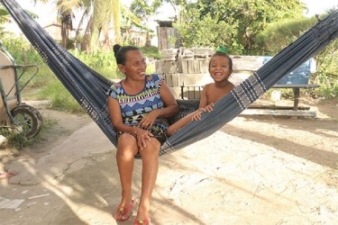 Ann Henry and her granddaughter in a hammock.  