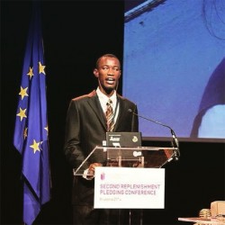 Leroy Phillips addressing the Global Partnership for Educations conference in Brussels last year. 