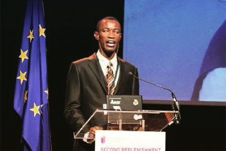 Leroy Phillips addressing the Global Partnership for Educations conference in Brussels last year.
