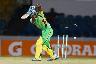 Jermaine Blackwood is clean bowled by Rayad Emrit, right who is ecstatic. (Photos by WICB Media/Ashley Allen) 
