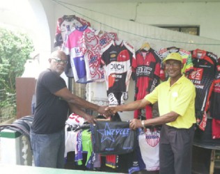 Flash back! GCANA’s Victor Rutherford, left, handing over the equipment to local representative William Howard recently. 