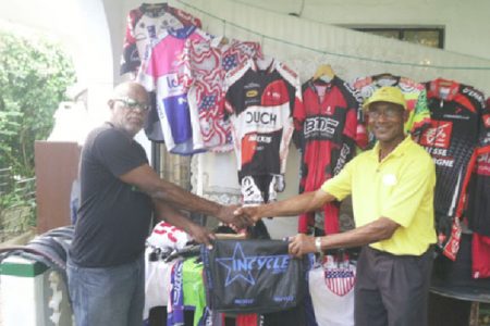 Flash back! GCANA’s Victor Rutherford, left, handing over the equipment to local representative William Howard recently.
