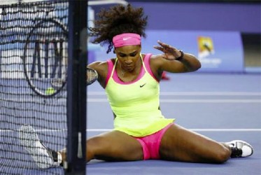 Serena Williams of the U.S. reacts as she slips while chasing after a ball during her women’s singles first round match against Alison Van Uytvanck of Belgium at the Australian Open 2015 tennis tournament yesterday CREDIT: REUTERS/ISSEI KATO 