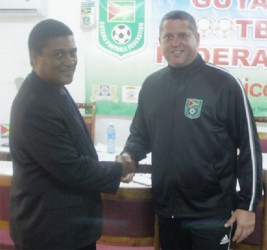 Anton Corneal, FIFA Regional Technical Development Officer of the South East Caribbean (left) and GFF Technical Director Claude Bolton share a moment during the latter’s recent visit to Guyana