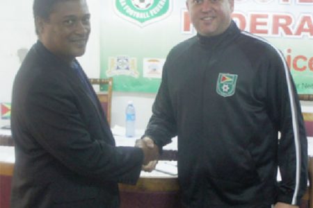 Anton Corneal, FIFA Regional Technical Development Officer of the South East Caribbean (left) and GFF Technical Director Claude Bolton share a moment during the latter’s recent visit to Guyana