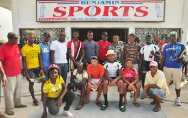 Yesterday’s top performers pose with their prizes outside the Benjamin’s Sports Store following the road race in Fyrish, East Berbice, Corentyne. (Orlando Charles photo) 