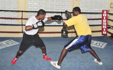 Caption Clive Atwell training yesterday at the Andrew ‘SixHead’ Lewis gym. (Orlando Charles photo) 