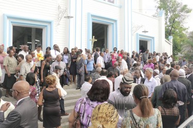  Funeral attendees in front of Christ Church yesterday (Photo by Arian Browne)