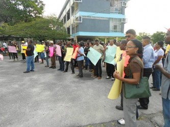 Staff and students  of the University of Guyana during protest action last week