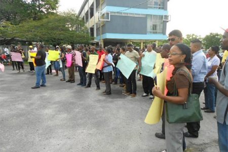 Staff and students  of the University of Guyana during protest action last week