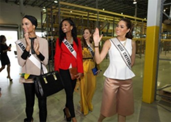 Reigning Miss Universe Gabriela Isler of Venezuela, on far right, tours Food For The Poor's warehouse with Miss Universe contestants (from left) Miss Jamaica Kaci Fennell, Miss Guyana Niketa Barker and Miss Nicaragua Marline Barberena.