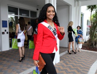 Miss Guyana Niketa Barker ends her visit to Food For The Poor with a wave.