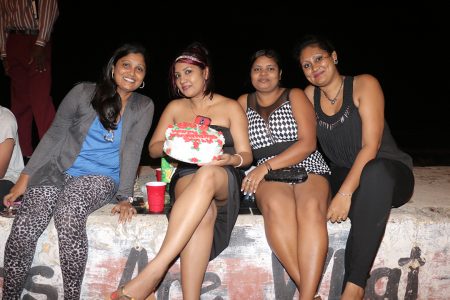 Another year, another birthday: This young woman and her friends chose to celebrate her New Year痴 birthday on the seawall.