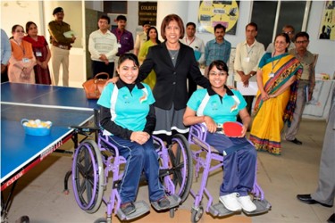 First Lady Deolatchmee Ramotar with two students during a visit to a school for the differently able in India (GINA photo)