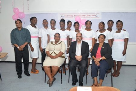 Minister of Health, Dr Bheri Ramsaran (sitting at centre) along with the tutors and class of Nursing Assistants (GINA photo)

