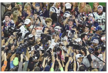 The New England Patriots celebrates with the Lombardi Trophy after beating the Seattle Seahawks in Super Bowl XLIX at University of Phoenix Stadium. Richard Mackson-USA TODAY Sports 